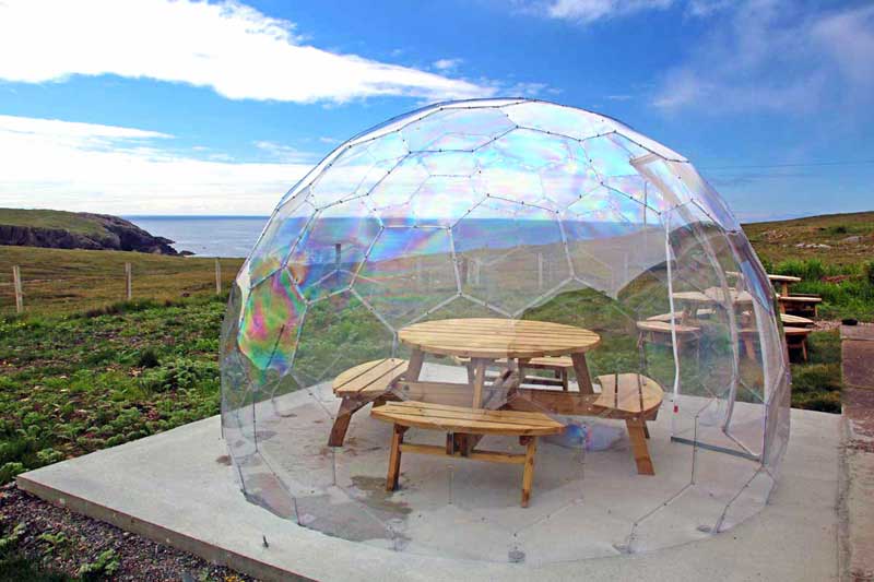 The Edge cafe on Isle of Lewis has pods with wooden tables inside and fabulous views out to sea