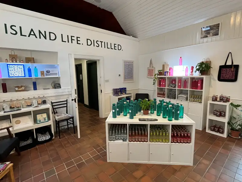 North Uist Distillery showing the green and pink bottles of gin for sale